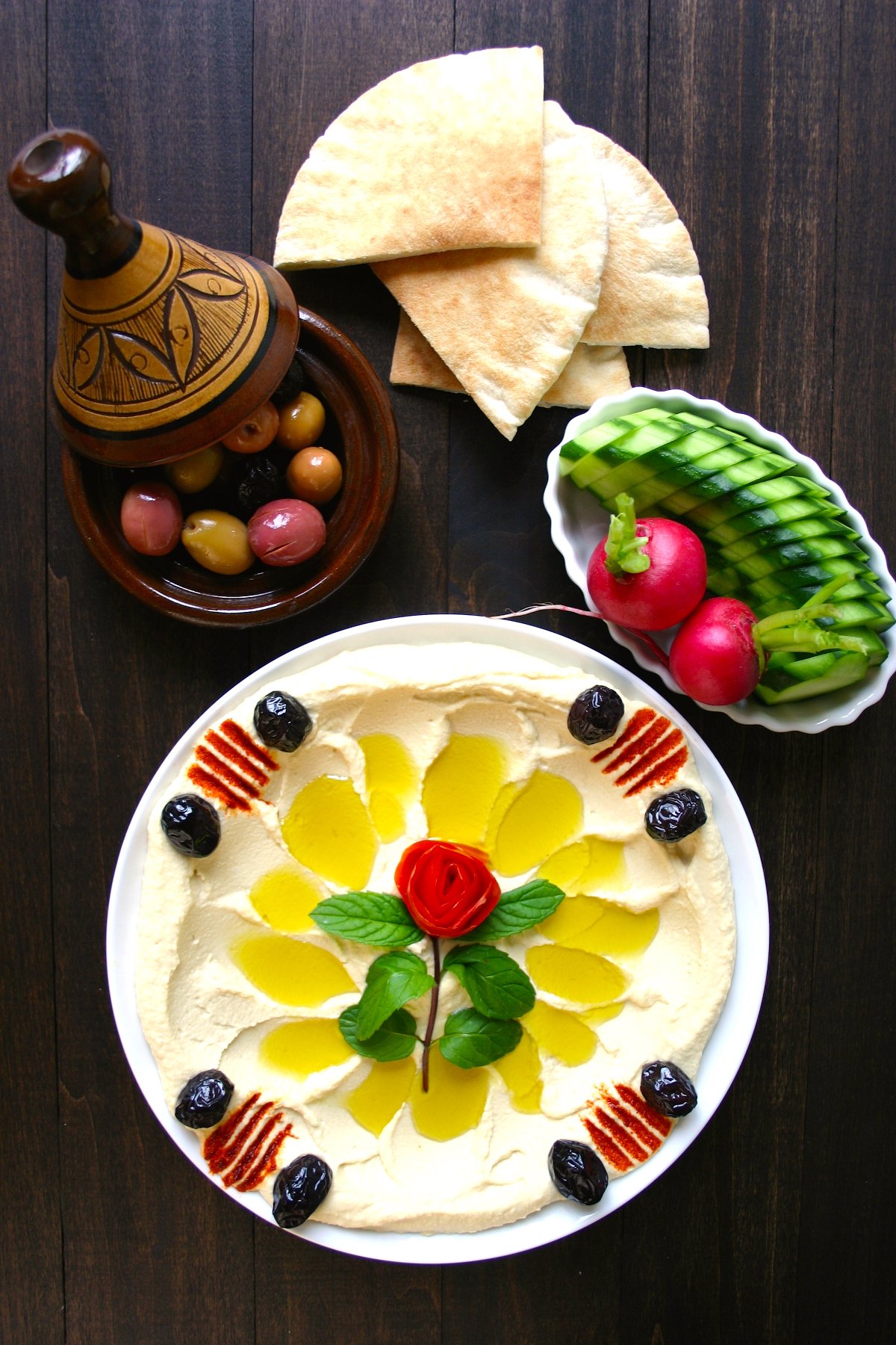 A simple recipe for an authentic, Basic Hummus. Creamy and satisfying, this hummus is perfect as an anytime snack and also makes great party food.