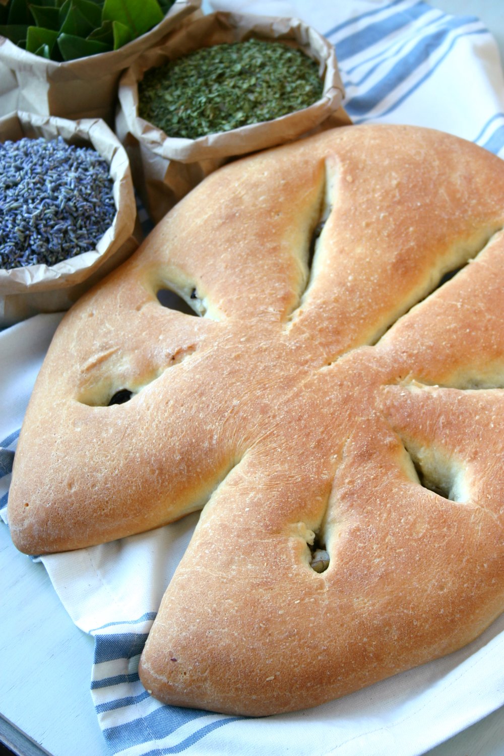 This recipe for Fougasse, a traditional Provençal bread, is crispy, crusty, and stuffed with olives and herbs.