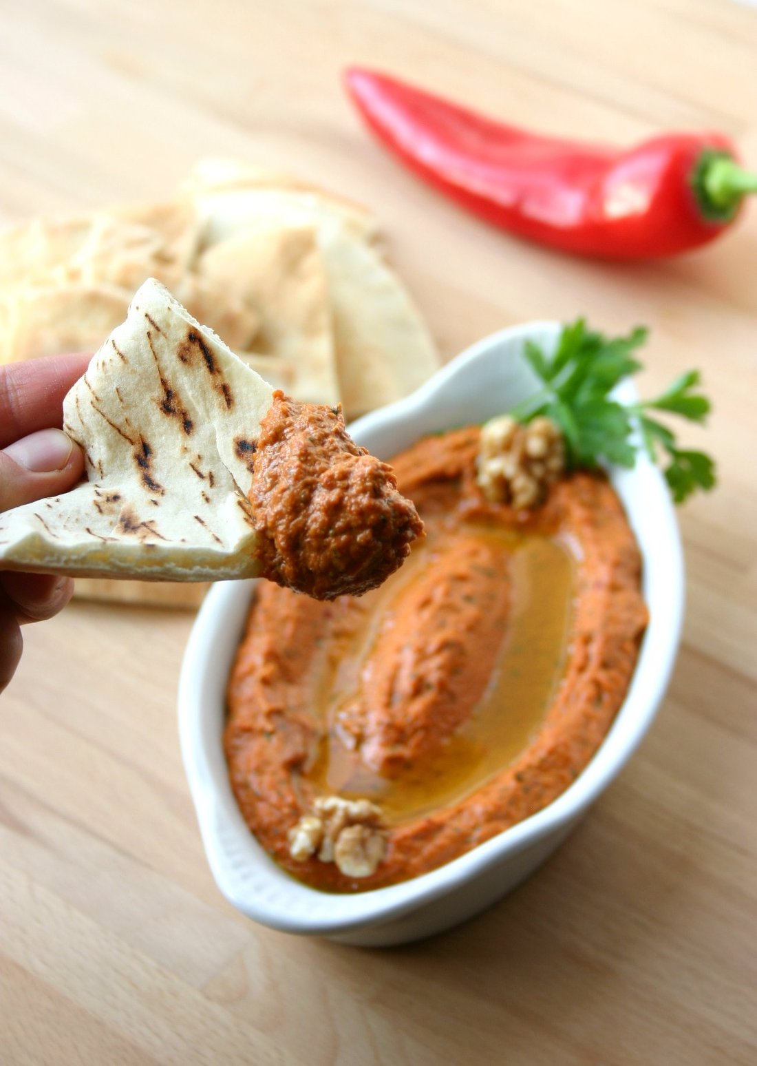 A classic recipe for Muhammara, a roasted red pepper spread with a spicy, sweet, tangy, garlicky, and smoky flavor.