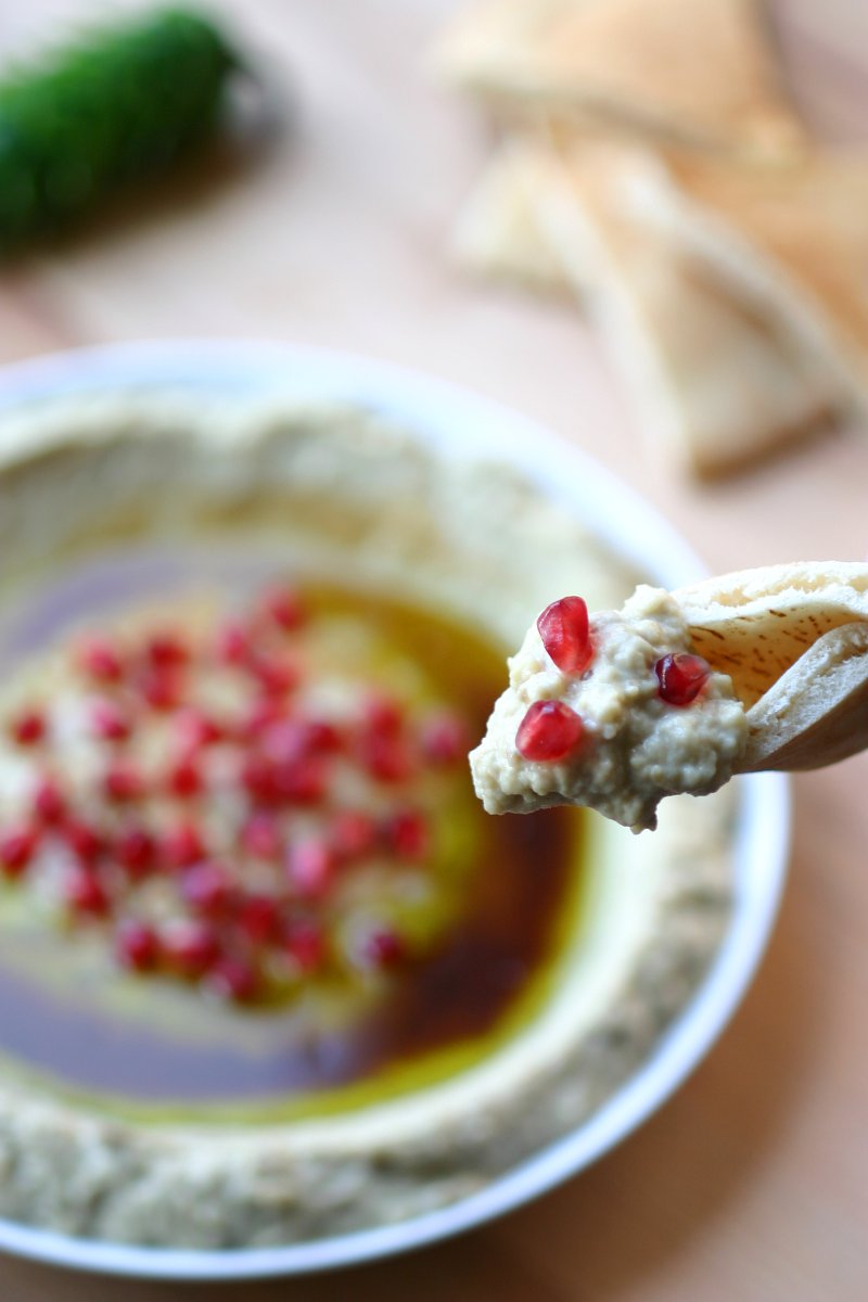 A 5-ingredient recipe for Mtabbal, a Middle Eastern eggplant spread finished with a drizzle of pomegranate molasses.