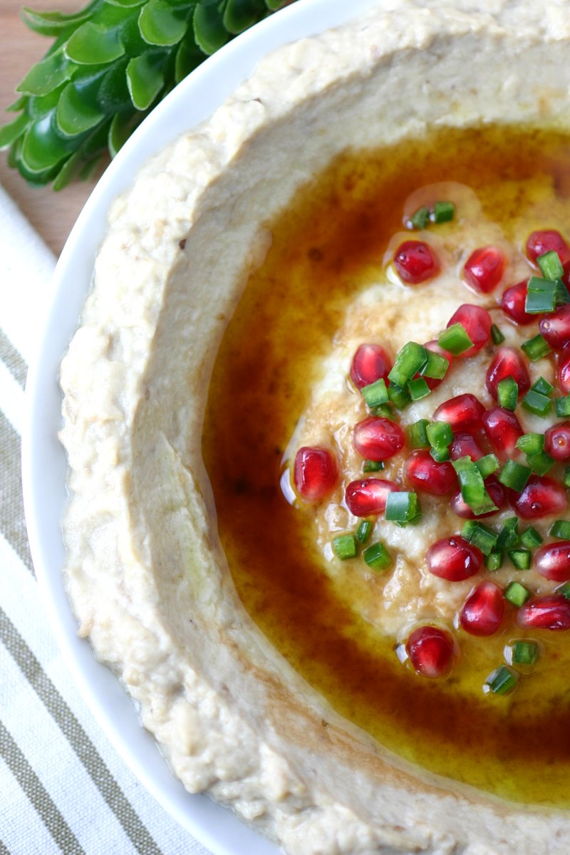 A 5-ingredient recipe for Mtabbal, a Middle Eastern eggplant spread finished with a drizzle of pomegranate molasses.