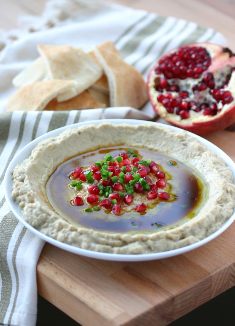 A 5-ingredient recipe for Mtabbal, a Middle Eastern eggplant spread finished with a drizzle of pomegranate molasses.