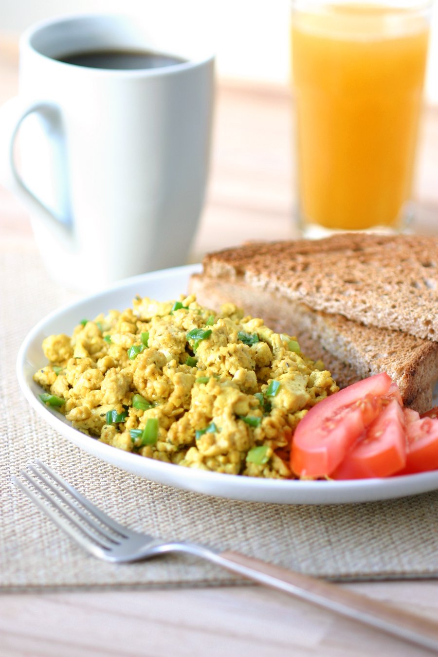 This flavorful Basic Tofu Scramble is simply delicious and can be endlessly adapted to your liking with different veggies, herbs, and spices.