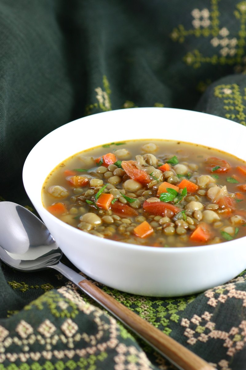 This Middle Eastern Green Lentil Soup features tender lentils, hearty chickpeas, and a spiced broth. Serve it as is or stir in some chopped greens.