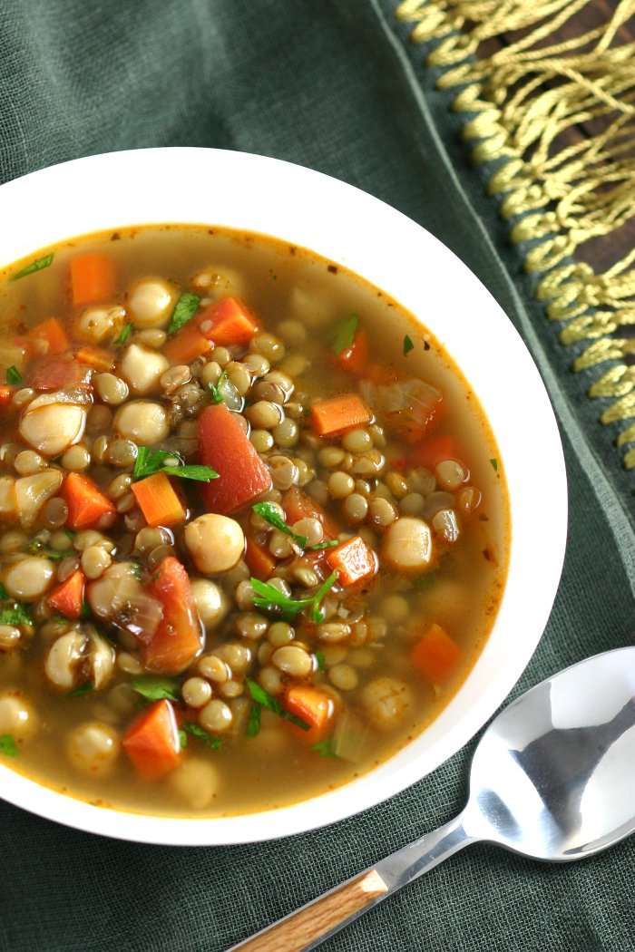 This Middle Eastern Green Lentil Soup features tender lentils, hearty chickpeas, and a spiced broth. Serve it as is or stir in some chopped greens.