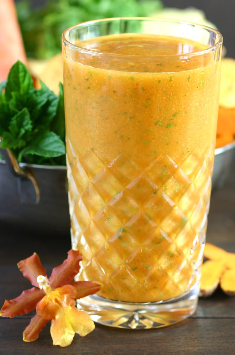 Mangos, carrots, and fresh turmeric combine with refreshing herbs to create this brilliantly-hued Mumbai Smoothie.
