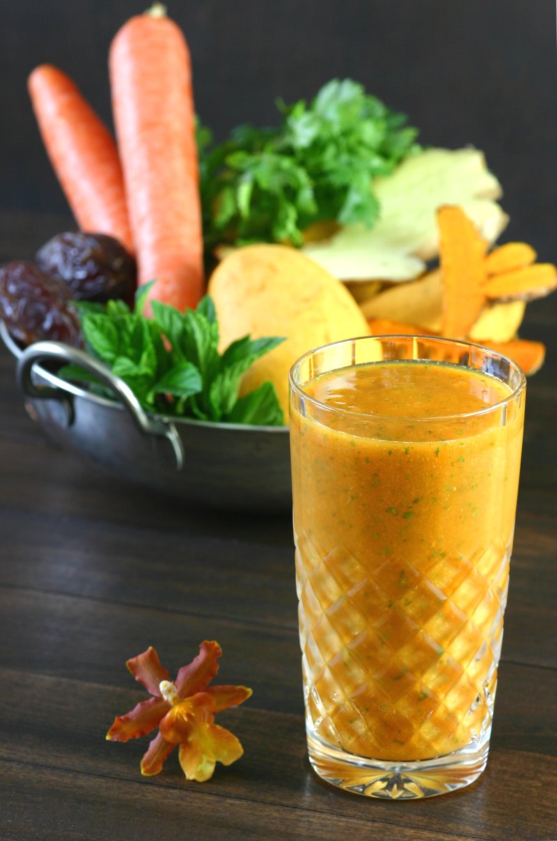 Mangos, carrots, and fresh turmeric combine with refreshing herbs to create this brilliantly-hued Mumbai Smoothie.