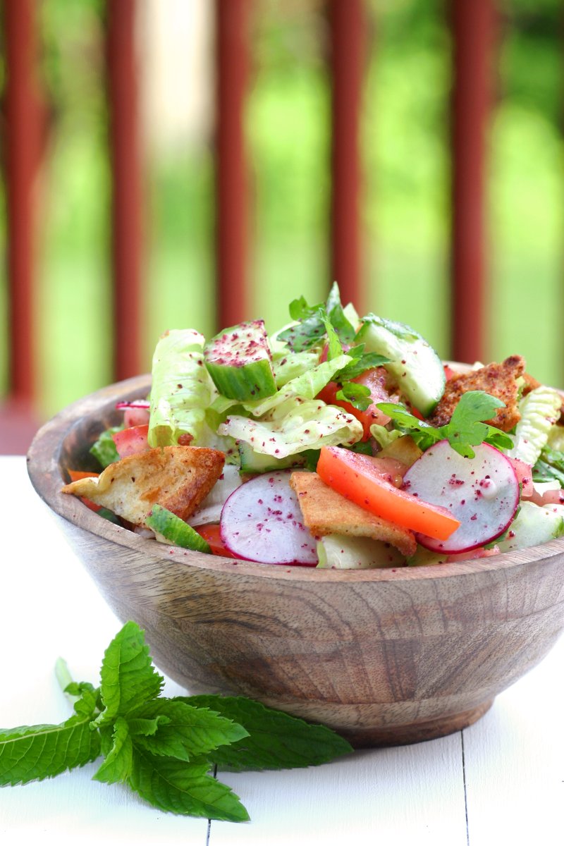 Think of Fattoush as the Middle Eastern version of the Italian panzanella salad--crisp veggies, fresh herbs, toasted pita bread, and a tangy sumac dressing.