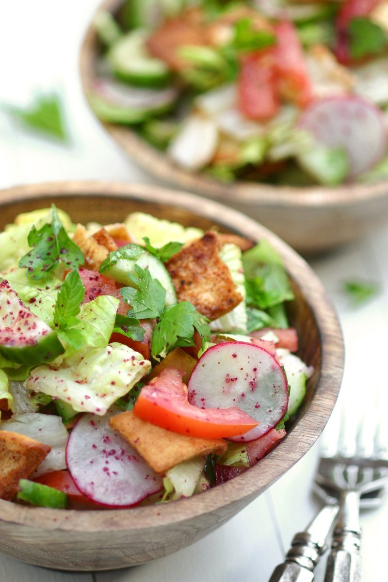 Think of Fattoush as the Middle Eastern version of the Italian panzanella salad--crisp veggies, fresh herbs, toasted pita bread, and a tangy sumac dressing.
