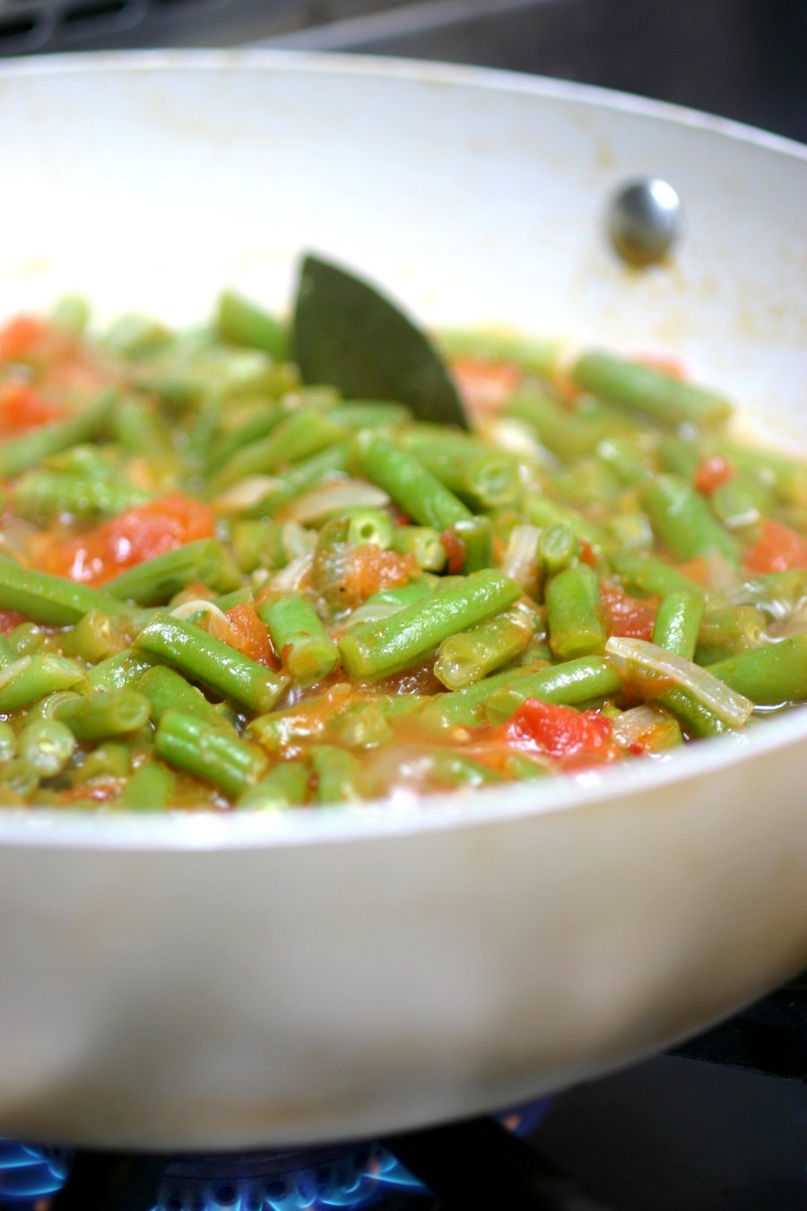 Middle Eastern Stewed Green Beans (Fasoolya bi Zayt) can be a side dish or even a light summer meal when served with lots of pita bread.