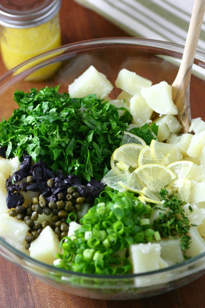 This Lemony Potato Salad is a change from the ordinary. It's tangy, herbaceous, and, thanks to the olives and capers, has little pops of flavor throughout.