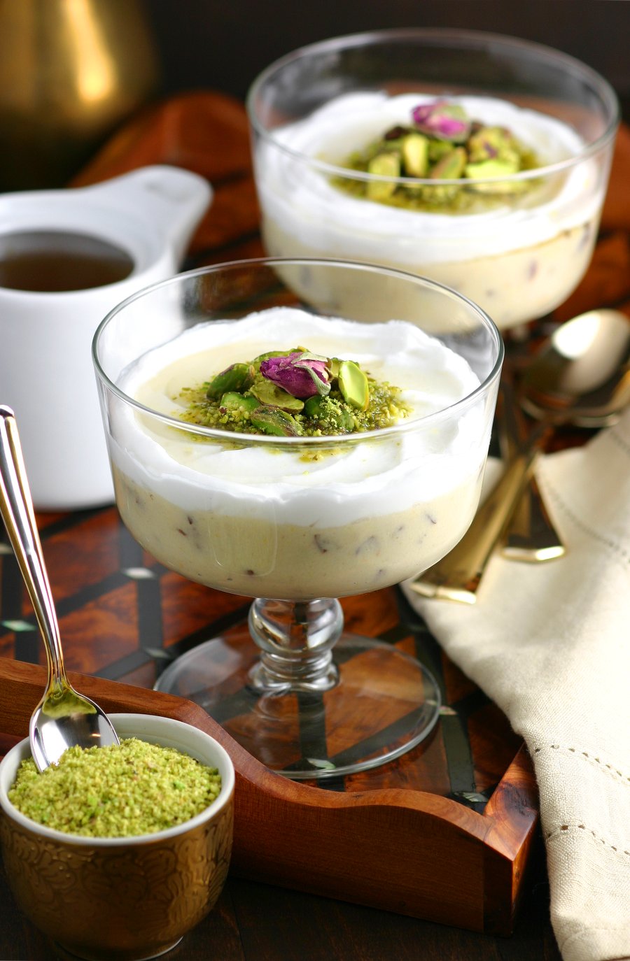 A very popular dessert throughout the Middle East, this Lebanese Semolina Pudding (Layali Lubnan) includes sweet-tart cranberries, thick coconut cream, ground pistachios, and a floral-scented syrup. This vegan recipe can be whipped up quickly, then it chills in the fridge until you are ready to dig in.