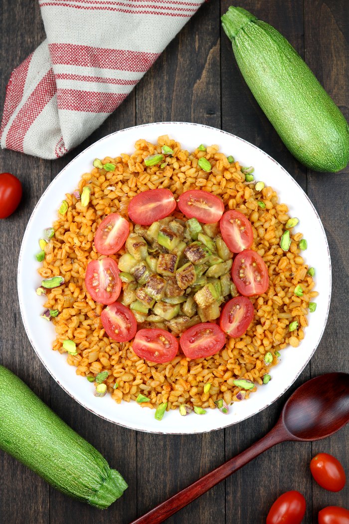 Whole grain bulgur, aromatic spices, and seared zucchini chunks are the core elements of this Middle Eastern-inspired Bulgur Wheat and Zucchini Bowl.
