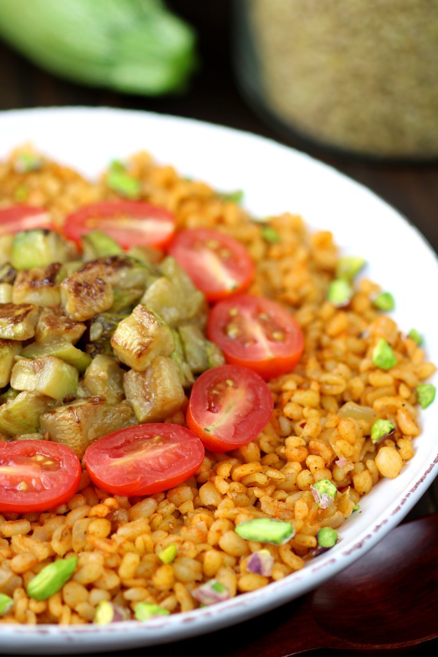 Whole grain bulgur, aromatic spices, and seared zucchini chunks are the core elements of this Middle Eastern-inspired Bulgur Wheat and Zucchini Bowl.