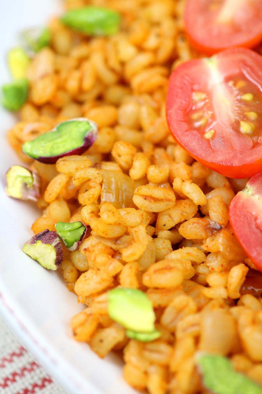 Whole grain bulgur, aromatic spices, and seared zucchini chunks are the core elements of this Middle Eastern-inspired Bulgur Wheat and Zucchini Bowl.