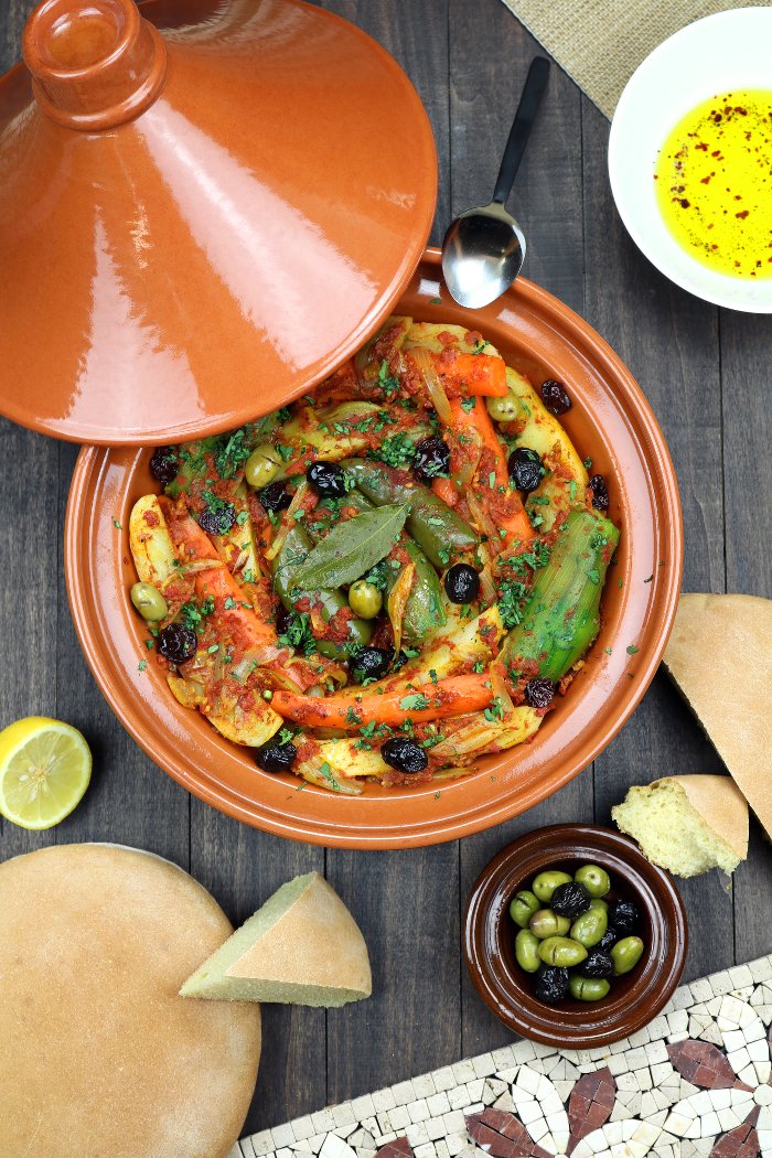 Vegetables are stewed in an aromatic tomato sauce until succulent and tender in this recipe for Simple Vegetable Tagine. Clay pot optional!