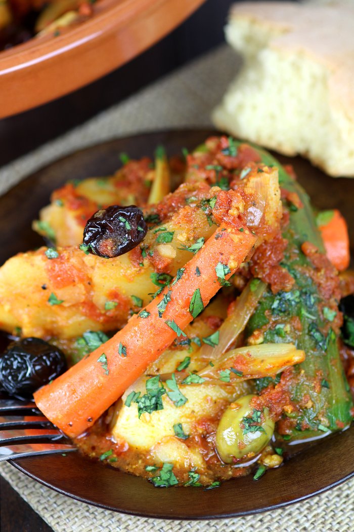 Vegetables are stewed in an aromatic tomato sauce until succulent and tender in this recipe for Simple Vegetable Tagine. Clay pot optional!