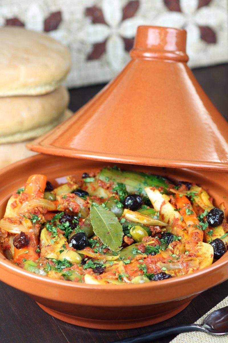 Vegetables are stewed in an aromatic tomato sauce until succulent and tender in this recipe for Simple Vegetable Tagine. Clay pot optional!