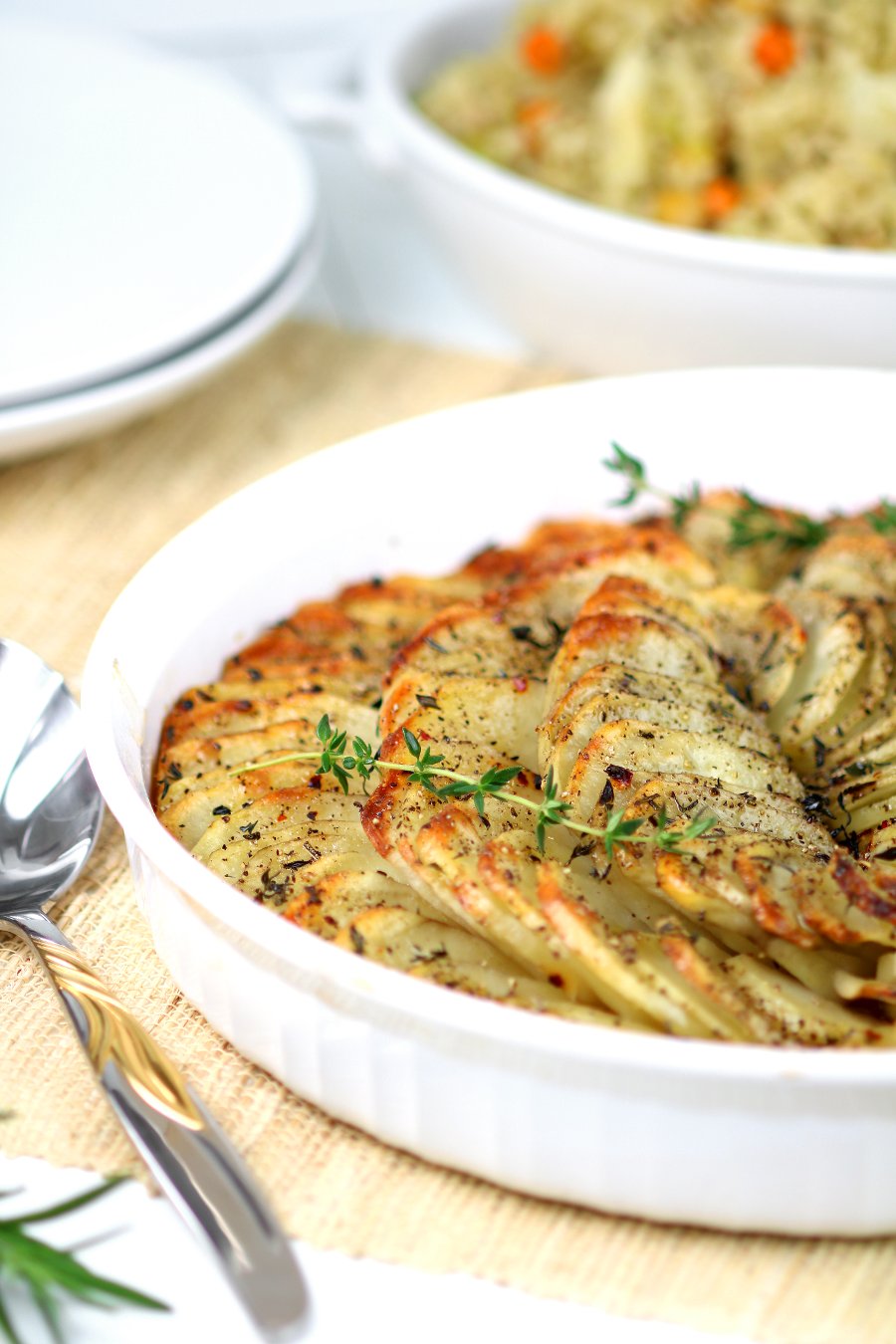 These rustic Oven-Roasted Sliced Potatoes will please with their herbed flavor and crispy, crunchy edges.