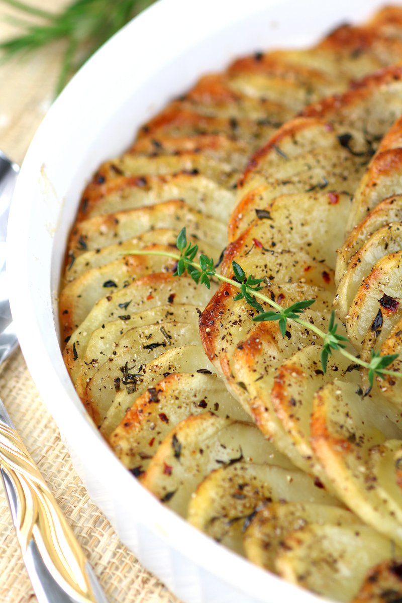 These rustic Oven-Roasted Sliced Potatoes will please with their herbed flavor and crispy, crunchy edges.