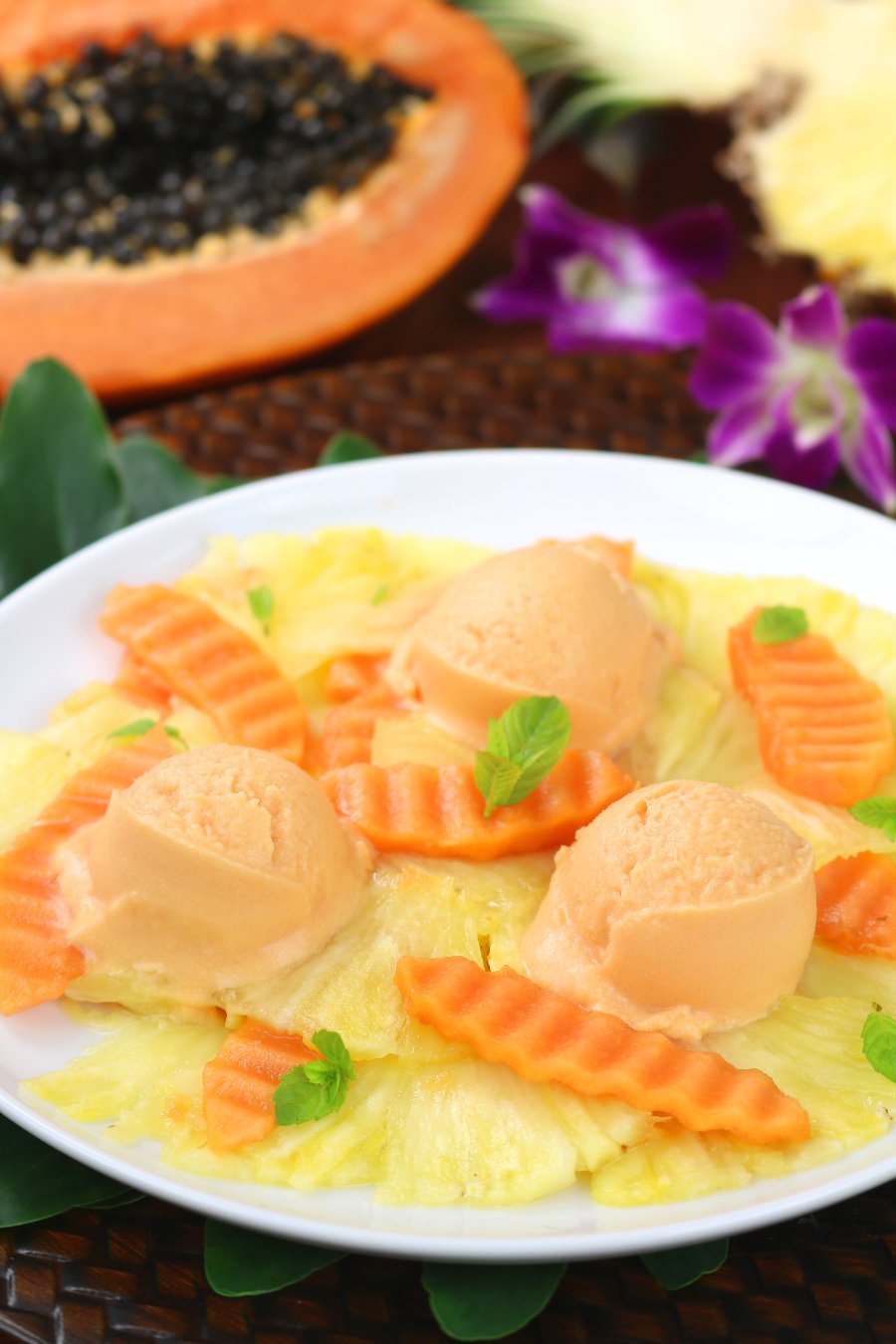 Fragrant tropical fruit blended with creamy coconut milk creates this sweet, cool, and refreshing Papaya Pineapple Sherbet.