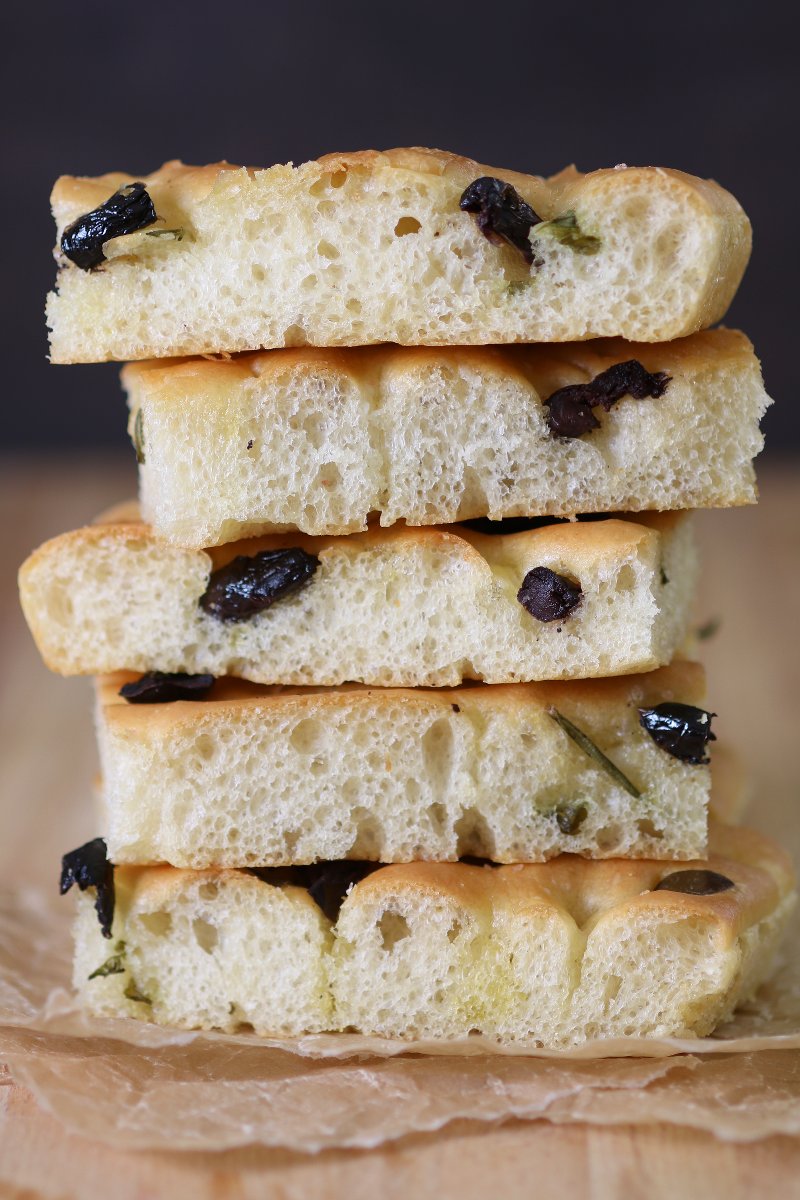 Olives, tomatoes, roasted veggies, herbs, or fruits...the topping possibilities are endless with this base recipe for Homemade Focaccia. And no kneading required!