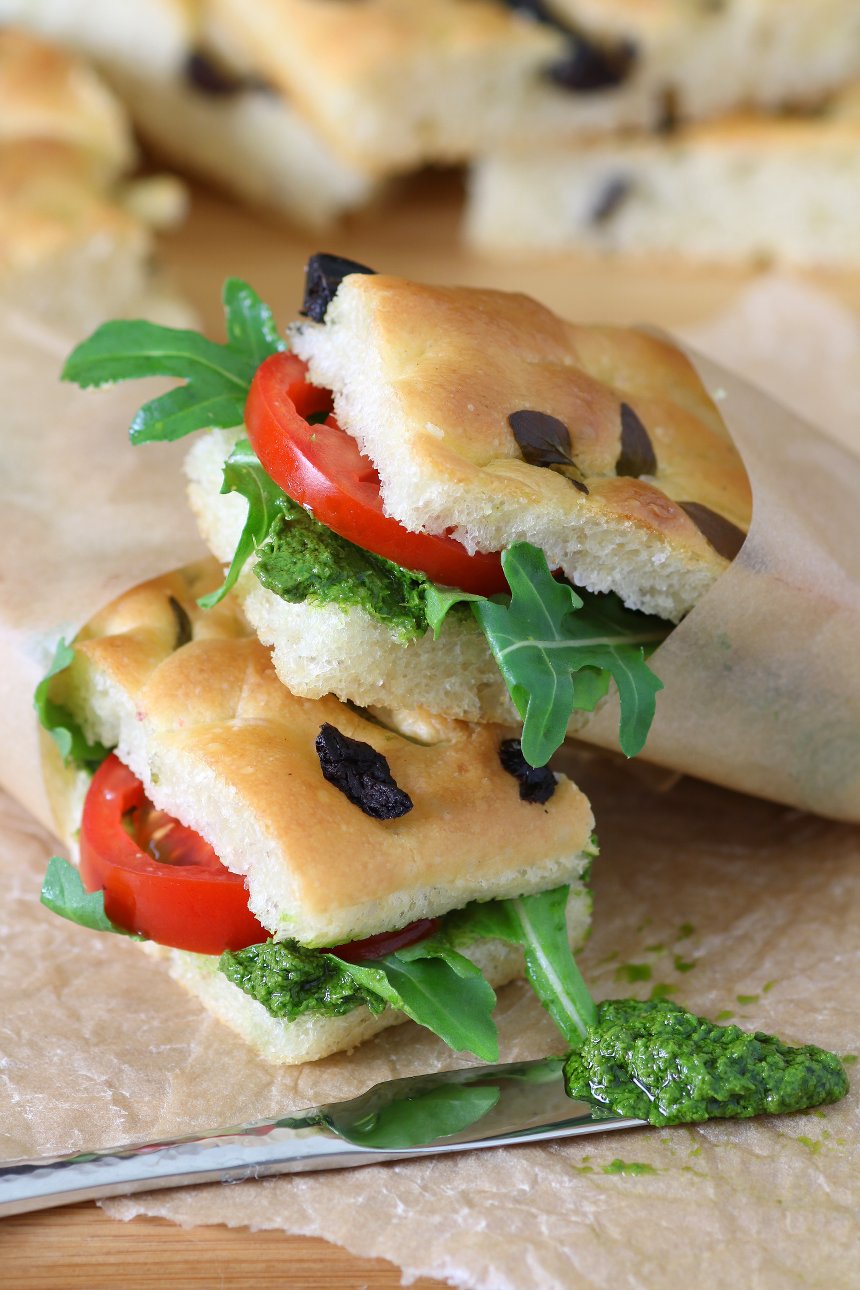 Olives, tomatoes, roasted veggies, herbs, or fruits...the topping possibilities are endless with this base recipe for Homemade Focaccia. And no kneading required!