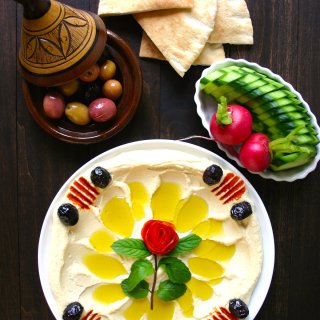 A simple recipe for an authentic, basic Hummus. Creamy and satisfying, this hummus is perfect as an anytime snack and also makes great party food.