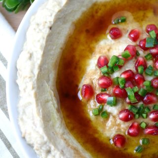 A 5-ingredient recipe for Mtabbal, a Middle Eastern eggplant spread finished with a drizzle of pomegranate molasses.