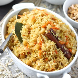 Bukhari Rice is an aromatic and flavorful Middle Eastern rice dish that features numerous spices to evoke its namesake--the Silk Road city of Bukhara.