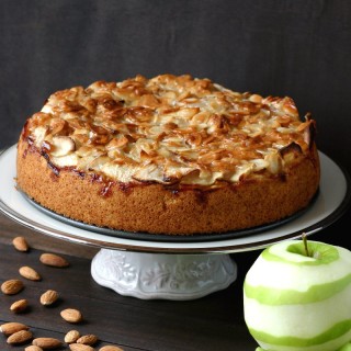 A vegan version of the classic German Apple Cake featuring a layer of moist cake topped with tart apples and smothered with sweet, toasted almonds.