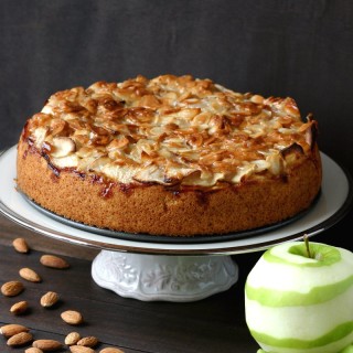 A vegan version of the classic German Apple Cake featuring a layer of moist cake topped with tart apples and smothered with sweet, toasted almonds.