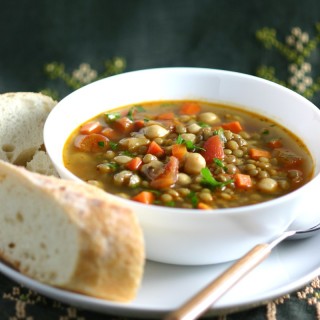 This Middle Eastern Green Lentil Soup features tender lentils, hearty chickpeas, and a spiced broth. Serve as is or stir in some chopped greens.