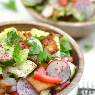 Think of Fattoush as the Middle Eastern version of the Italian panzanella salad--crisp veggies, fresh herbs, toasted pita bread, and a tangy sumac dressing.