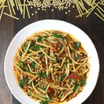 Lentils, noodles, carmelized onions, tomatoes, and a spiced broth come together to make this filling Lentil and Spinach Rashteh.