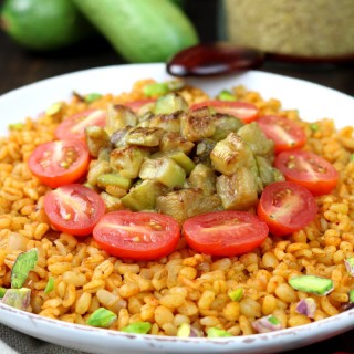 Whole grain bulgur, aromatic spices, and seared zucchini chunks are the core elements of this Middle Eastern-inspired Bulgur Wheat and Zucchini Bowl.